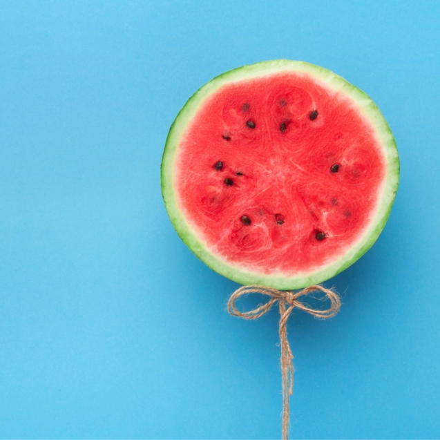 watermelon-balloon-on-blue-background-creative-57PNH8Q