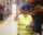 warehouse-worker-standing-large-storage-center-showing-ok-hand-gesture-satisfied-delivering-goods
